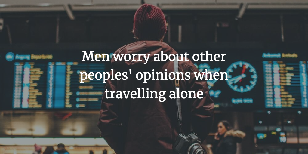 The text reads, 'Men worry about other peoples' opinions when travelling alone.' A male solo traveller stands staring at the flight departure board.