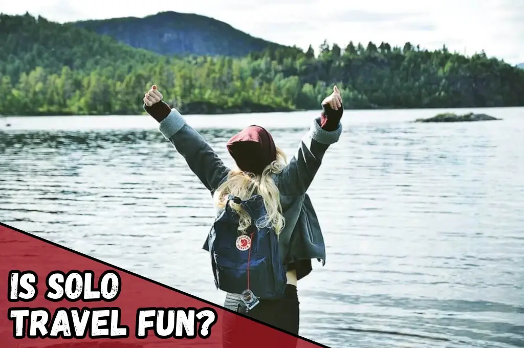 Is traveling alone fun? A solo female traveller cheers with excitement.