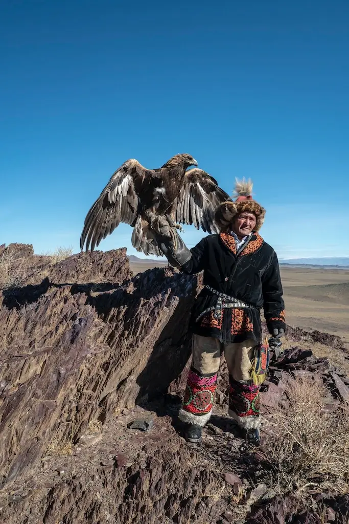 Nomad holding his Golden Eagle for hunting in Mongolia.