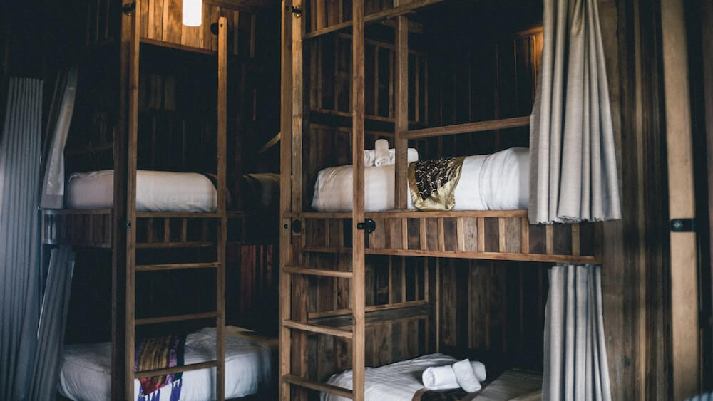 A hostel dorm room with bunk beds