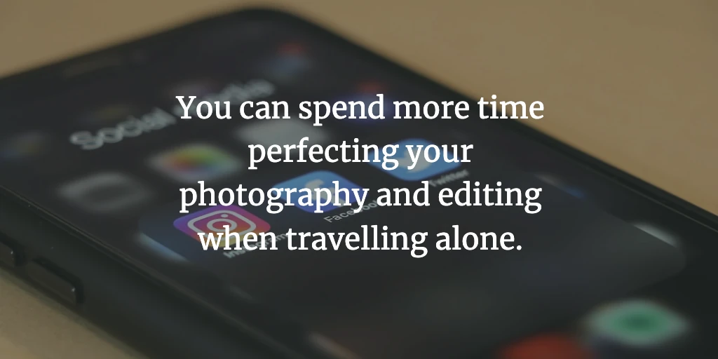 A smartphone with three apps on the home screen: Instagram, Facebook and Twitter. The text reads, 'You can spend more time perfecting your photography and editing when travelling alone.'