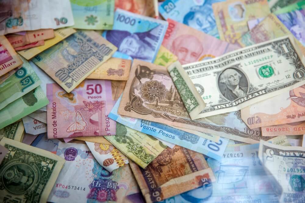 A pile of international currencies in cash.