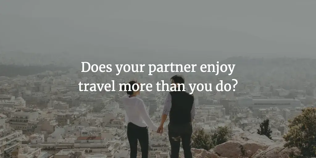 A couple stands on a hill overlooking a city. The text reads, 'Does your partner enjoy travel more than you do?'