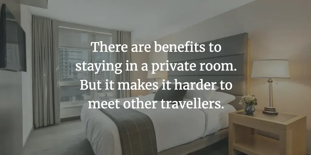 A hotel room. The text reads, 'There are benefits to staying in a private room. But it makes it harder to meet other travellers.'