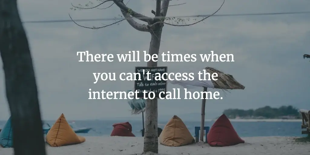 Beanbags and umbrellas on a beach beside a sign saying no wifi. The text reads, 'There will be times when you can't access the internet to call home.'