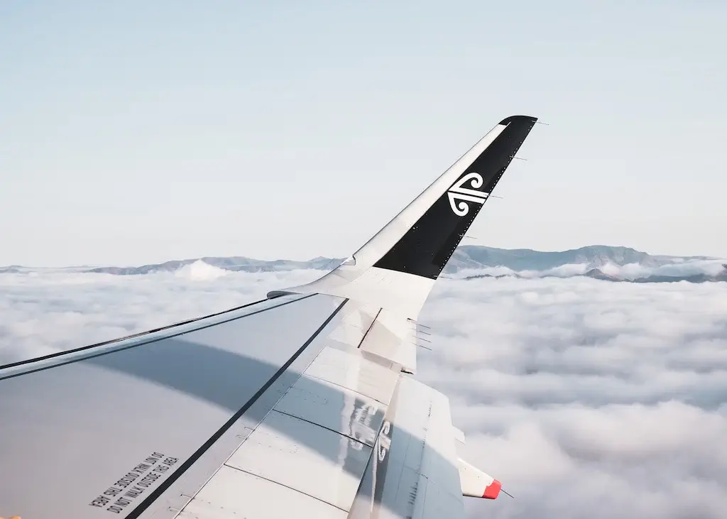An Air New Zealand flight from a passenger window.