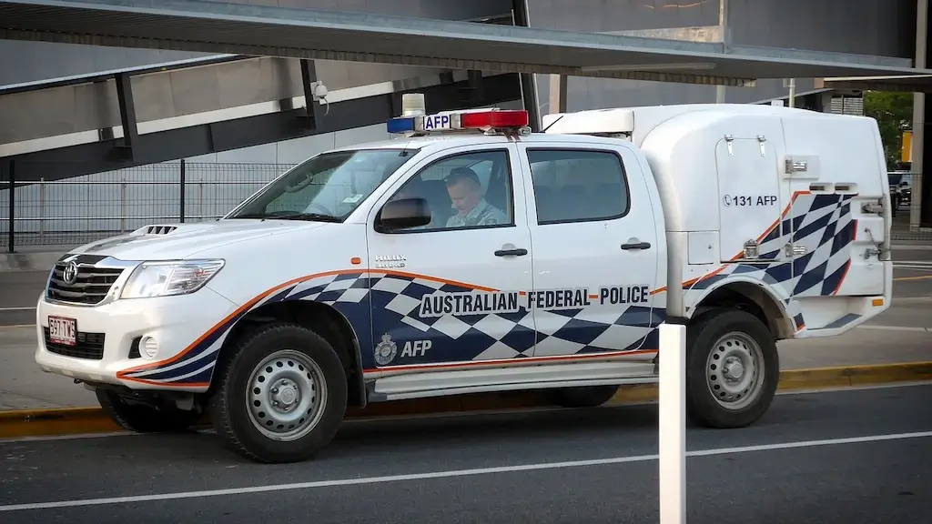 An Australian Federal Police vehicle parked outside of Brisbane airport.