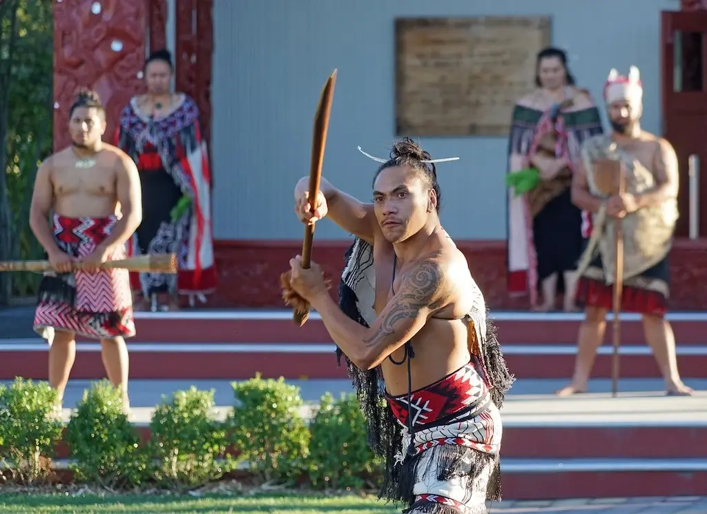 Maori performing a war dance at the Waitangi Treaty Grounds in the Bay of Islands, New Zealand.