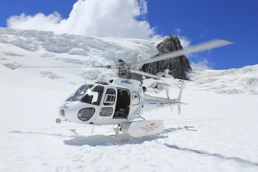 A helicopter landing on Tasman Glacier in New Zealand.