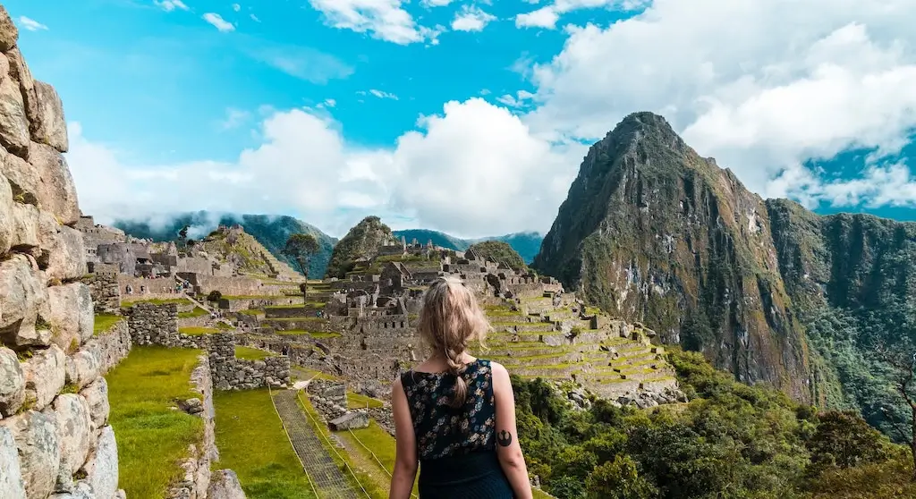 A female solo traveller hiking Machu Picchu