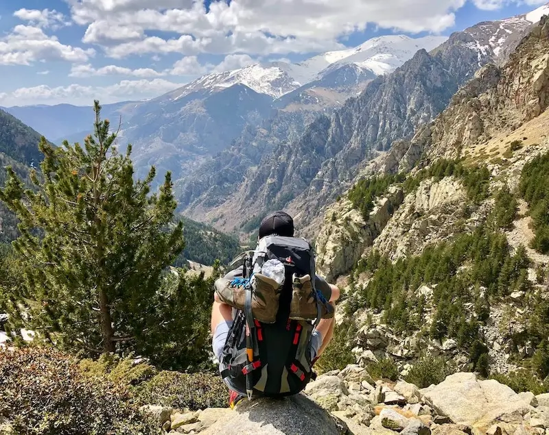 Male solo travellers hiking mountains in Europe.