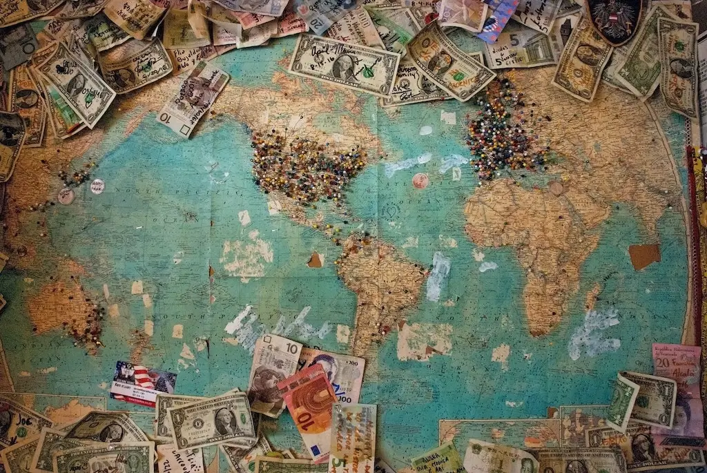 A world map with international currencies