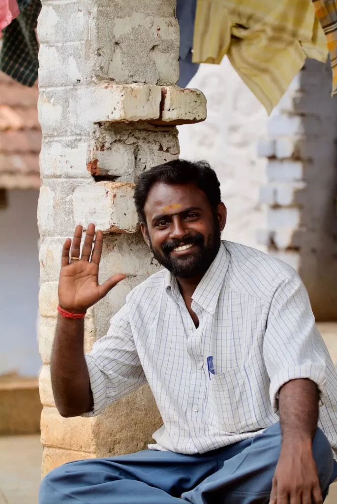 Indian man waving goodbye with his hand