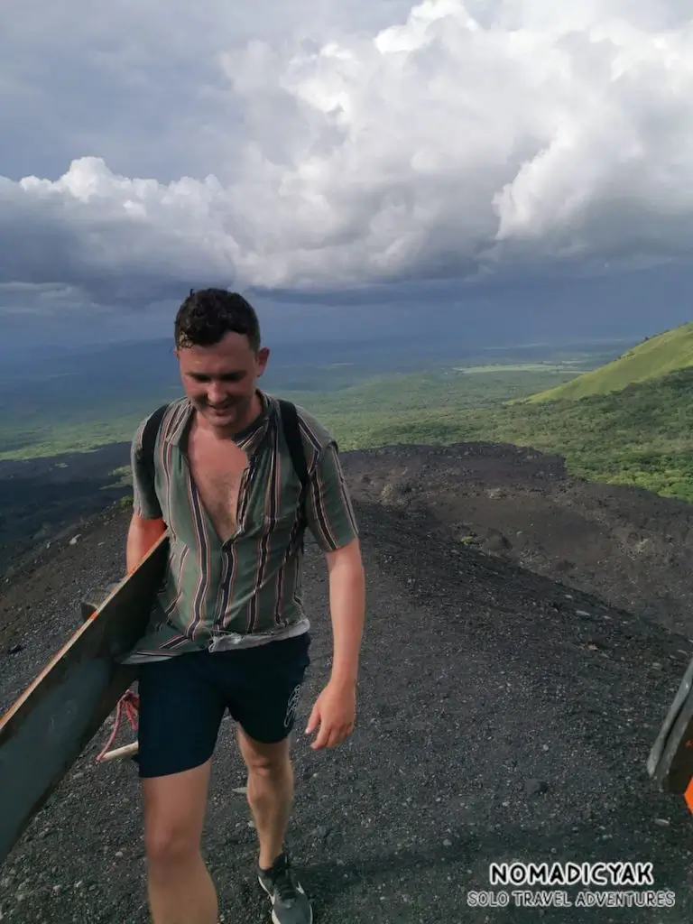 Ben Dale (solo traveller) volcano boarding in Nicaragua. 