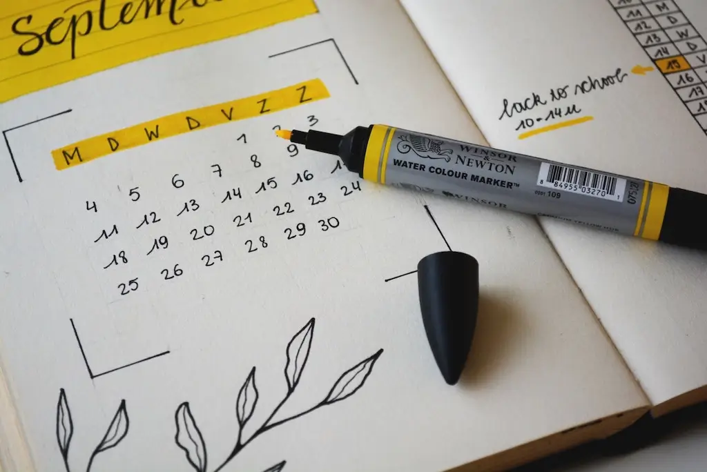 Paper diary calendar with a yellow highlighter.