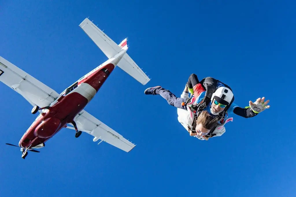 Tandem skydiving from a propellor plane.