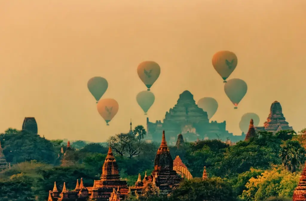Hot air balloons rising over Bagan Temples at sunrise in Myanmar (Burma).