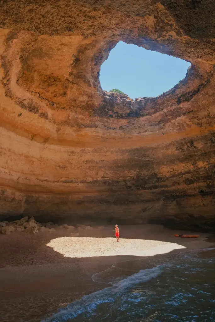 Solo male traveller in Benagil Cave, Algrave, Portugal. 