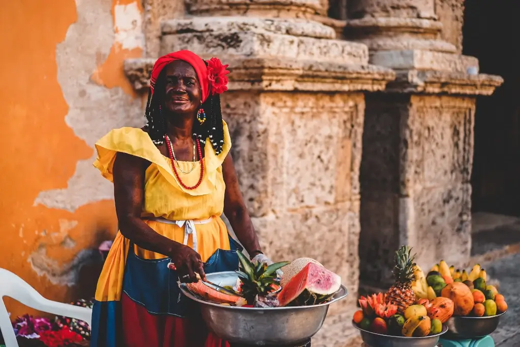 Woman selling fresh fruit on the streets of Colombia. 