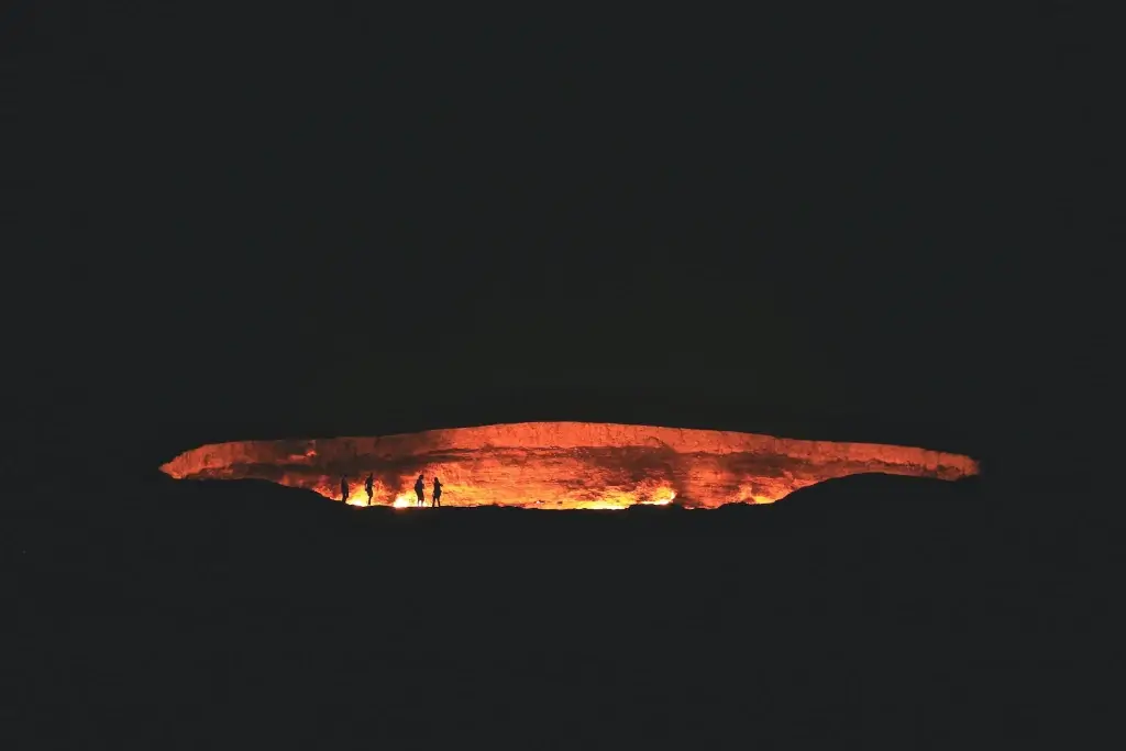 Door to Hell gas crater looking fiery at night in Darvaza, Turkmenistan