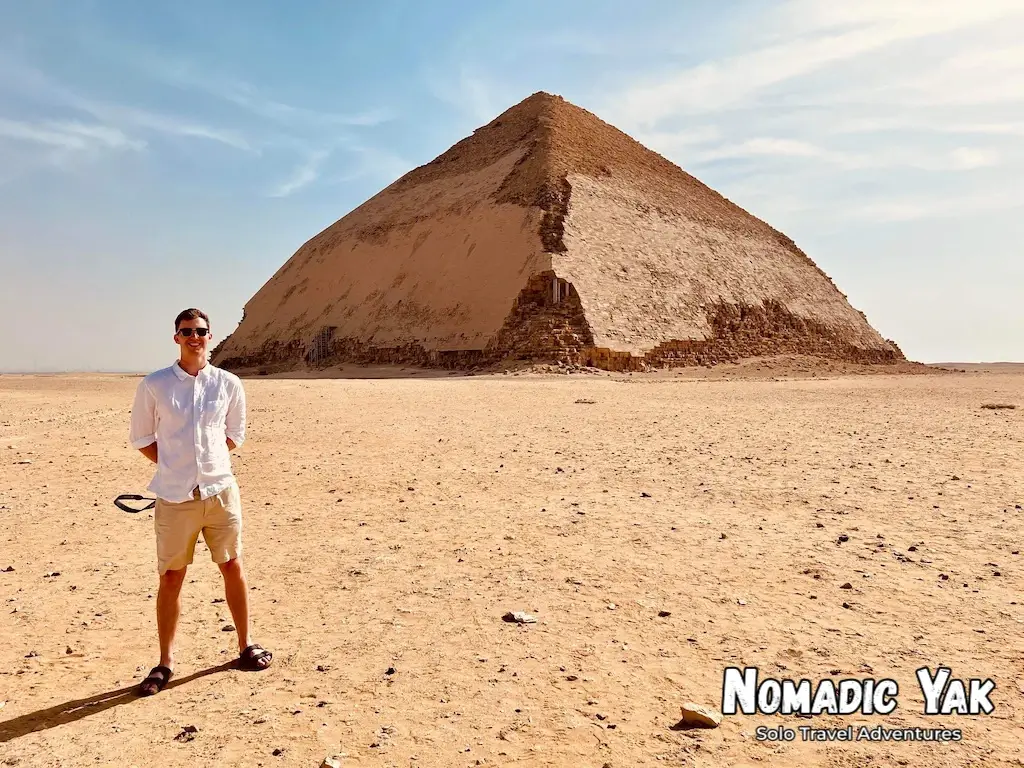 Harry Dale (Nomadic Yak) standing in front of the Bent Pyramid in the Saqqara Necropolis, Egypt. 