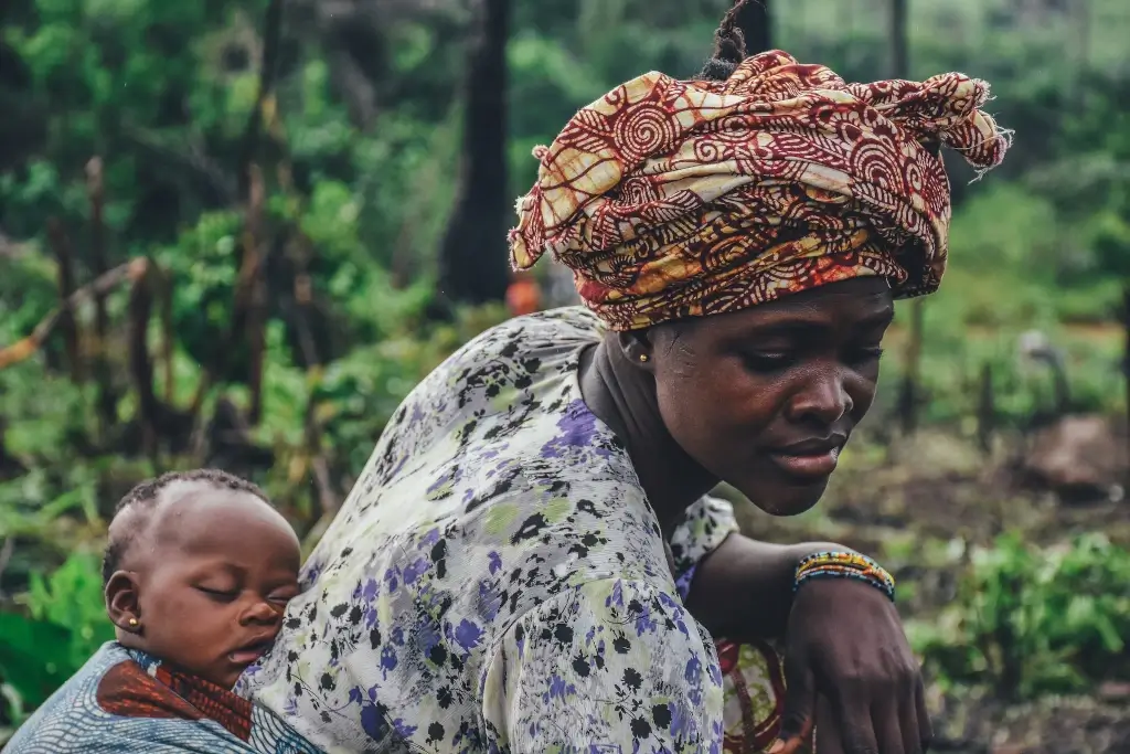 Woman carrying baby on her back in Sierra Leone. 